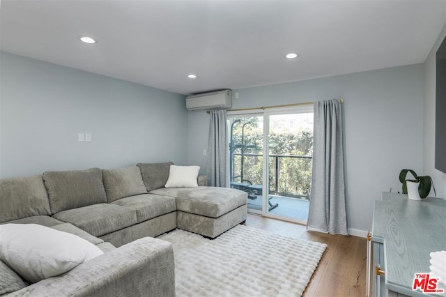 living room featuring wood-type flooring and a wall mounted AC