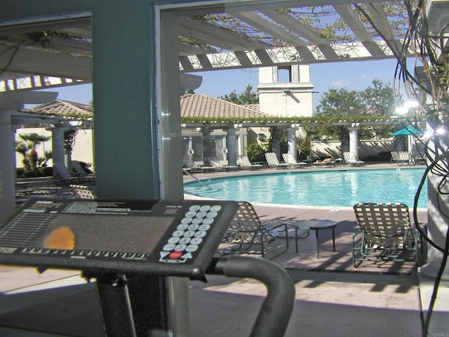 view of swimming pool with a pergola