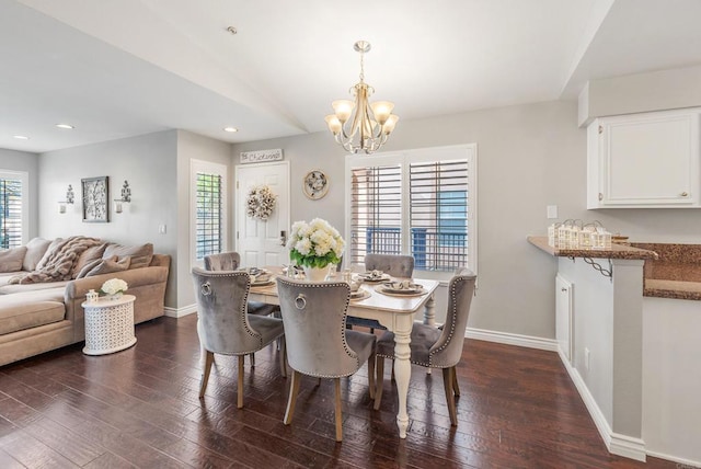 dining space featuring plenty of natural light and dark hardwood / wood-style floors