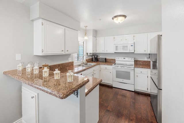 kitchen with white cabinetry, sink, kitchen peninsula, light stone countertops, and white appliances