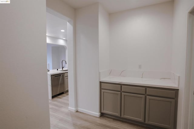 bathroom featuring sink and hardwood / wood-style floors