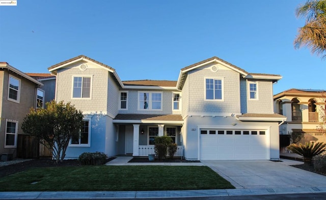 view of front of home with a garage and a front yard