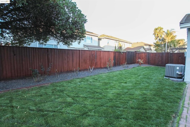 view of yard with central AC unit