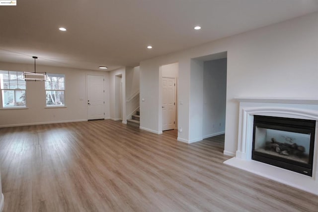 unfurnished living room featuring light hardwood / wood-style flooring