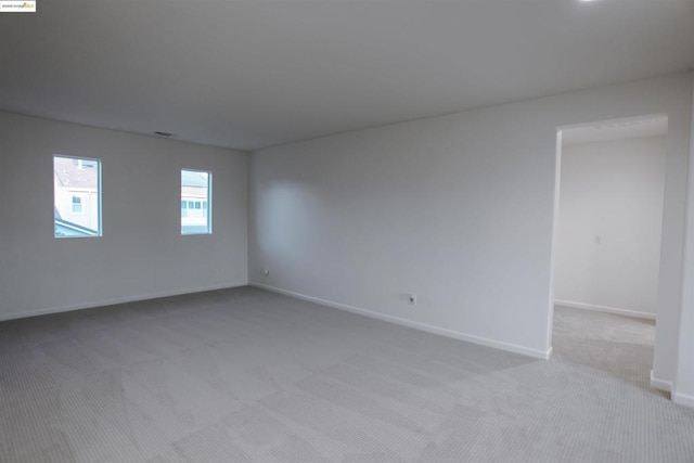 empty room with light colored carpet