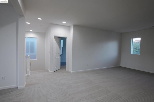 empty room featuring light colored carpet