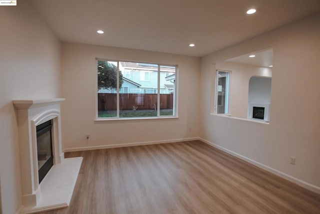 unfurnished living room featuring light wood-type flooring