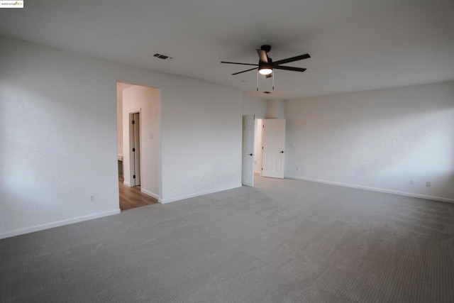 unfurnished room featuring ceiling fan and carpet flooring