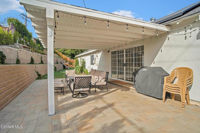 view of patio with a grill and a pergola