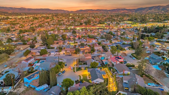 aerial view at dusk with a mountain view