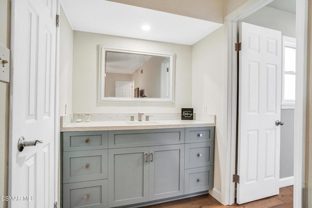 bathroom featuring hardwood / wood-style flooring and vanity