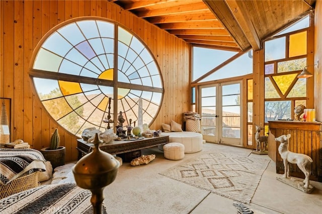 sunroom featuring vaulted ceiling, wooden ceiling, and french doors