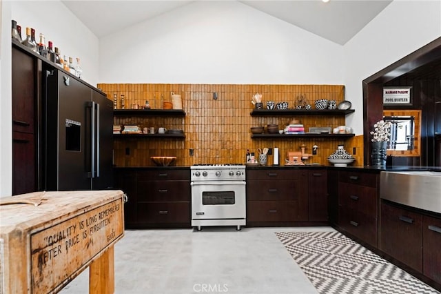 kitchen with high end appliances, dark brown cabinets, and high vaulted ceiling