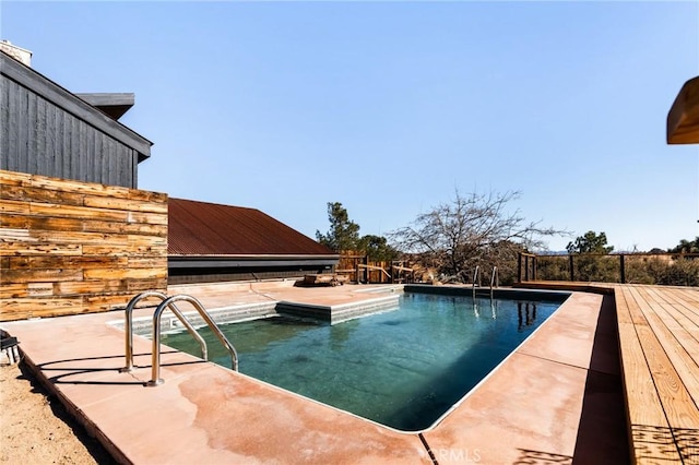 view of pool featuring a patio