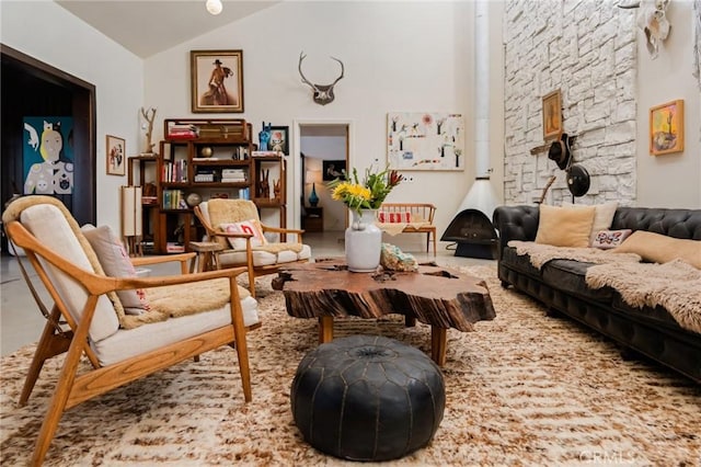 sitting room featuring vaulted ceiling