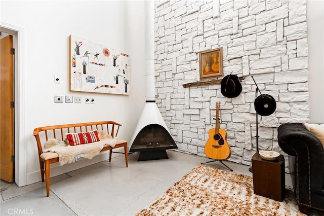 sitting room featuring concrete flooring