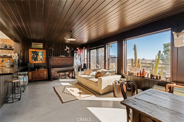 sunroom / solarium featuring wooden ceiling