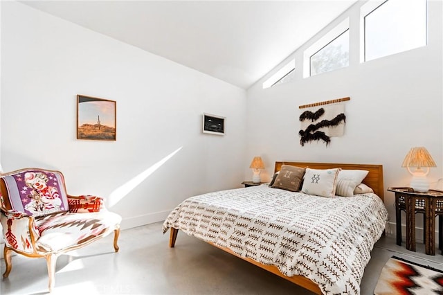 bedroom featuring high vaulted ceiling