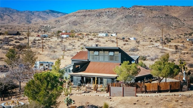 back of property featuring a mountain view