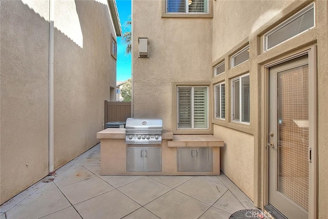 view of patio / terrace with fence, grilling area, and area for grilling