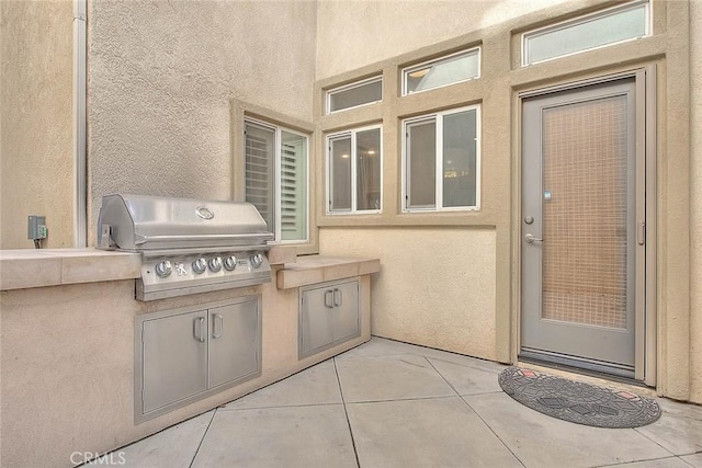 view of patio with area for grilling and grilling area