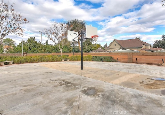 view of sport court featuring community basketball court and fence