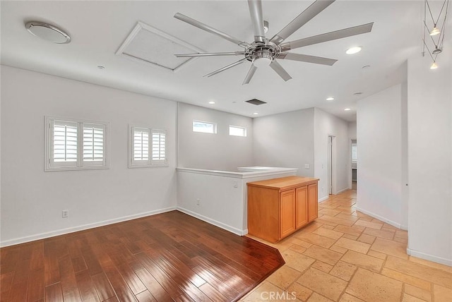 kitchen with visible vents, baseboards, light wood-style flooring, ceiling fan, and recessed lighting