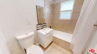 full bathroom with shower / tub combo, vanity, toilet, and tile patterned flooring