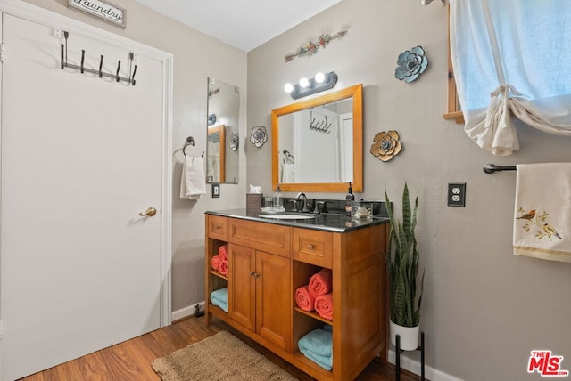 bathroom featuring vanity and wood-type flooring