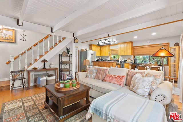 living room featuring beam ceiling and wood-type flooring