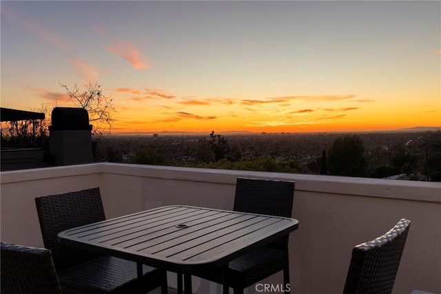 view of balcony at dusk