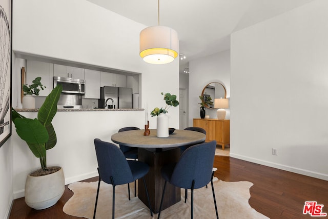 dining area with hardwood / wood-style floors