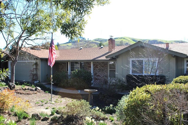 rear view of house with a garage