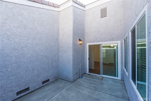 doorway to property with a patio