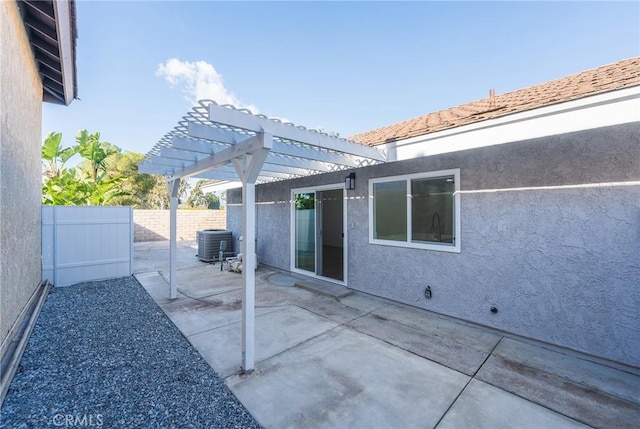 view of patio / terrace with a pergola and central AC