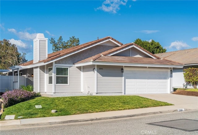 ranch-style home with a garage and a front yard