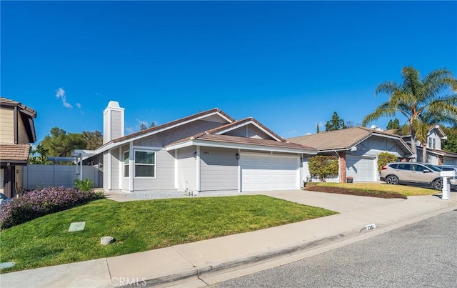 single story home with a garage and a front lawn