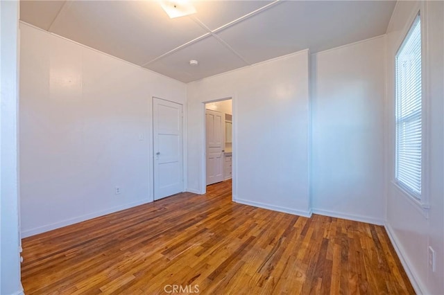 spare room featuring hardwood / wood-style flooring