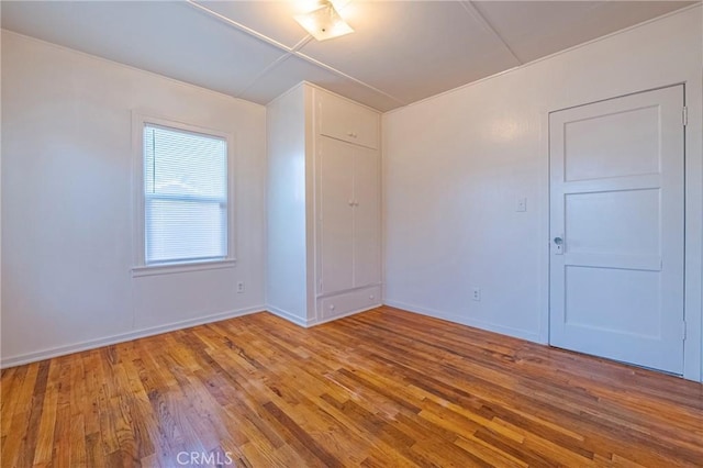 unfurnished room featuring wood-type flooring