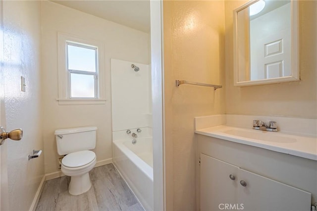 full bathroom with wood-type flooring, shower / washtub combination, vanity, and toilet