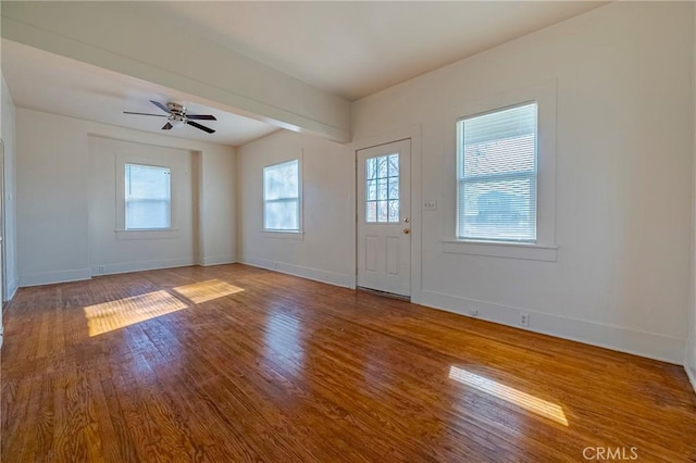 entryway with wood-type flooring and ceiling fan