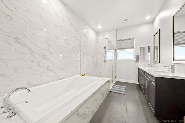 bathroom with vanity, tile patterned flooring, plenty of natural light, and separate shower and tub