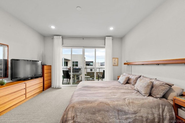 carpeted bedroom featuring access to outside