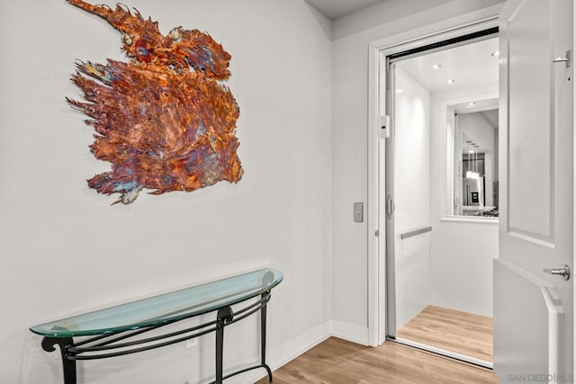 corridor featuring light hardwood / wood-style flooring