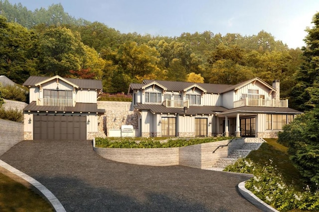 view of front of property with a garage and a balcony