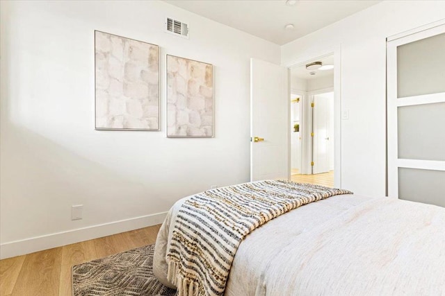 bedroom with wood-type flooring