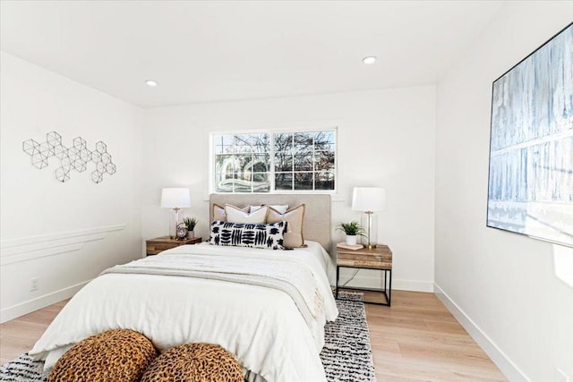 bedroom with light hardwood / wood-style flooring