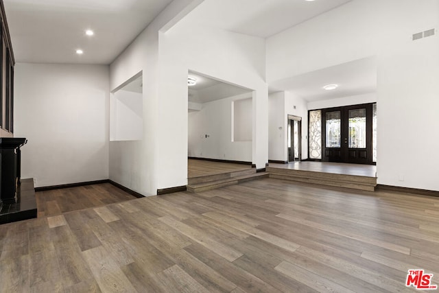 entryway featuring hardwood / wood-style floors and french doors