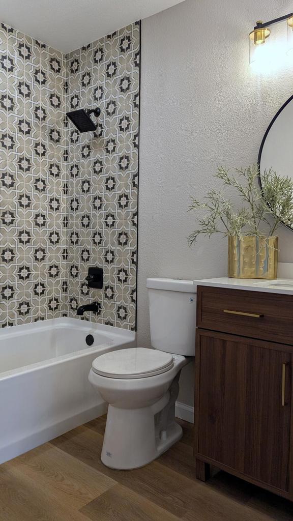 full bathroom with vanity, toilet, shower / bath combination, and hardwood / wood-style floors