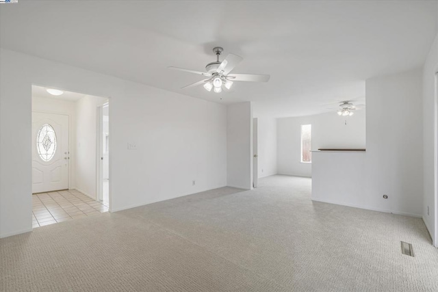 carpeted empty room with ceiling fan